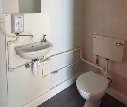 Toilet inside unit